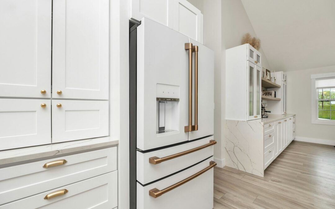 A view of a white kitchen cabinets